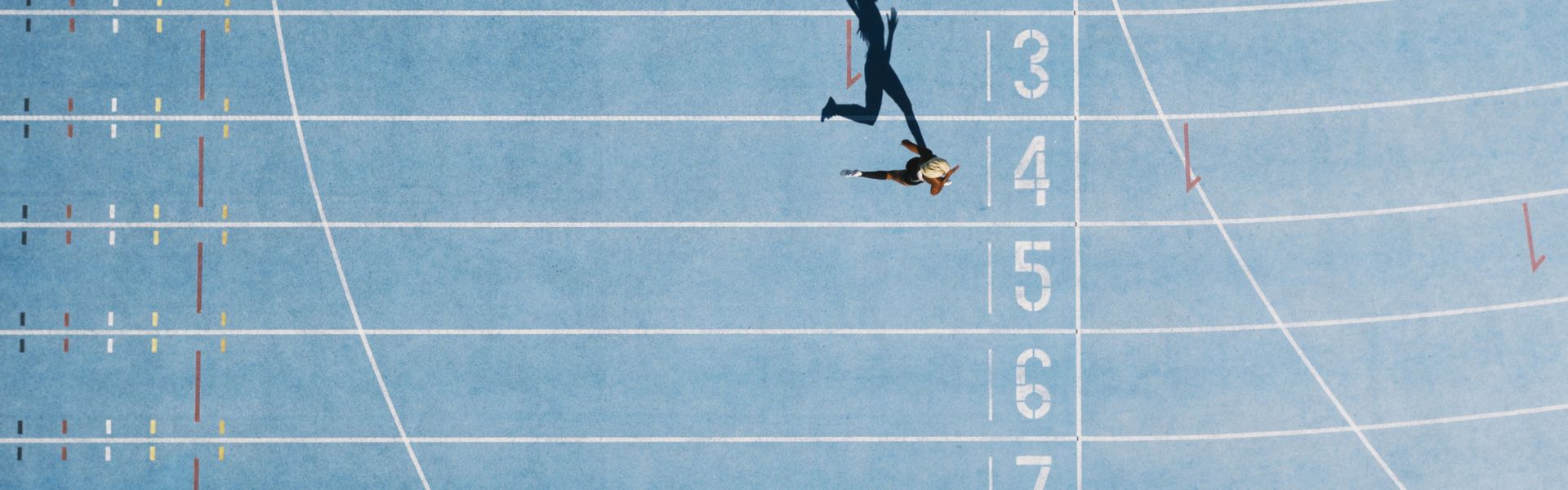 A runner sprints on a track