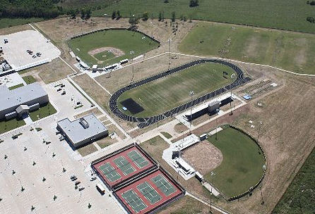 Overhead perspective of a football field and stadium